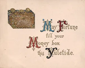 Money box and coins on a Christmas card Money box and coins on a Christmas card