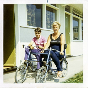 Mother and Son on a Quadricycle at a Holiday Camp Mother and Son on a Quadricycle at a Holiday Camp