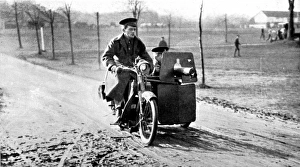 A motor-cycle with a side-car machine gun A motor-cycle with a side-car machine gun