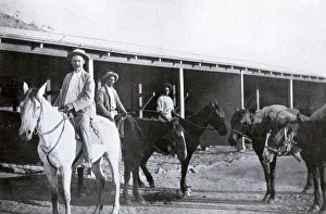 Mounted police constable and aborigine trackers on patrol Mounted police constable and aborigine trackers on patrol
