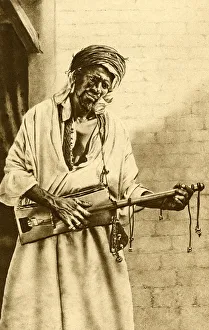 Musician with guitar, Algeria, North Africa Musician with guitar, Algeria, North Africa