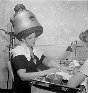 New York, New York. Getting a manicure while drying hair at New York, New York. Getting a manicure while drying hair at