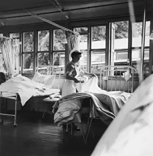 Vintage Hospital Scene Prints: Nurse Making a Bed
