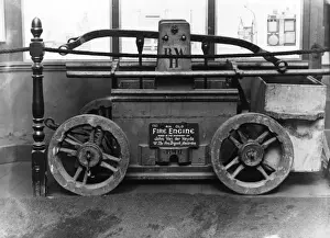 Prints of An old Dutch fire engine in a museum, made in the workshop of John van der Heyde, on loan from the Amsterdam Fire Brigade London Fire Brigade Museum Prints: Old Dutch Fire Engine Museum Print, Amsterdam 18th Century