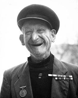 Old man with military colours and medal, Balham, SW London Old man with military colours and medal, Balham, SW London