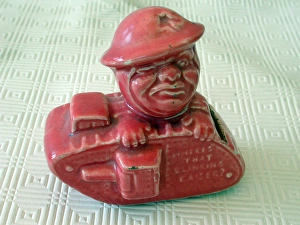 Old Bill Pink glazed money box in the form of a WW1 tank Old Bill Pink glazed money box in the form of a WW1 tank