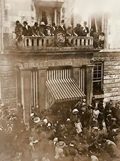 Prints of An opening custom of the Anglesey Hunt, whereby hot coppers or small change (heated in a bucket by the fire) are thrown from the balcony of the Bulkeley Arms Hotel following the hunt ball Related Image Prints: Anglesey Hunt Opening Print: Hot Coppers Toss Tradition