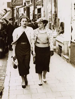 A pair of rich girls off shopping - passing an Etam Store A pair of rich girls off shopping - passing an Etam Store