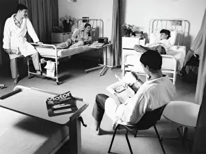 Prints of Scene at the Metropolitan Police Medical Centre, Hendon, north west London, showing four patients in dressing gowns and pyjamas chatting in a hospital ward Hospital Prints: Hendon Hospital Ward Scene Print, 1950s London