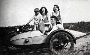 Four people on a 1929 Ariel motorcycle & sidecar Four people on a 1929 Ariel motorcycle & sidecar