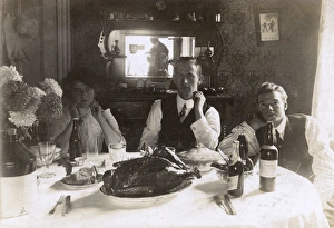 Three people at a table, photographer reflected in mirror Three people at a table, photographer reflected in mirror