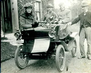 Four people with a veteran antique car Four people with a veteran antique car