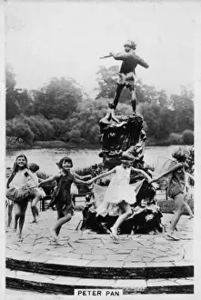 Prints of Happy children dancing in a fairy ring around Sir George Framptons statue of Peter Pan in Kensington Gardens, which was erected on 1 May 1912 Kensington Gardens Prints: Peter Pan Statue in Kensington Gardens Print, 1912