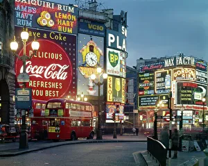 Piccadilly Circus by night, London. Date: 1960s Piccadilly Circus by night, London. Date: 1960s