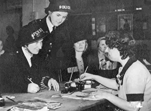WW2 Policewomen Prints: Two policewomen registering for war work