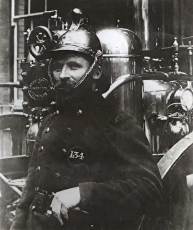 Portrait of a late Victorian MFB fireman with engine Portrait of a late Victorian MFB fireman with engine