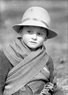 Print of a small boy in Devon, wearing warm winter clothing