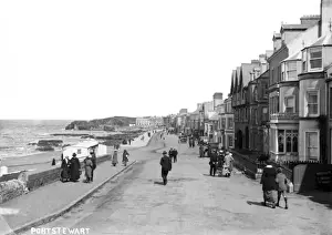 Prints of Portstewart - a view down the Promenade to the harbour with a lot of people on the road. (Location: Northern Ireland; County Londonderry; Portstewart). Date: circa early 1900s Portstewart Prints: Portstewart Promenade Print, Early 1900s