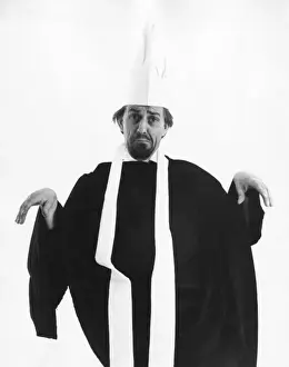 1960s Print: Priest or Chef A limp-wristed priest (or chef)