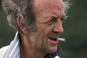 Profile portrait of male poacher with cigarette in his mouth Profile portrait of male poacher with cigarette in his mouth