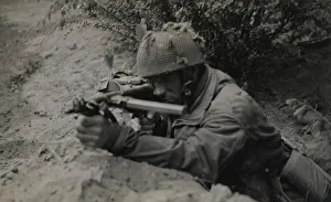 Pte J Connington of Selby, Yorks, in action with Sten gun Pte J Connington of Selby, Yorks, in action with Sten gun