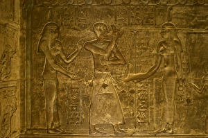 Ptolemaic temple of Hathor and Maat. Male figure flanked by Ptolemaic temple of Hathor and Maat. Male figure flanked by