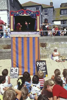 Punch and Judy show on the beach, Cornwall Punch and Judy show on the beach, Cornwall