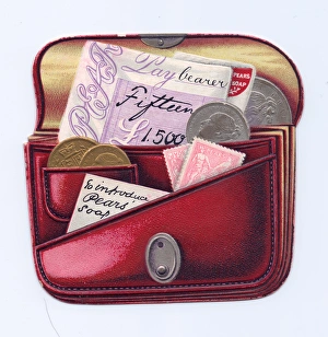 Red purse full of money on a cutout card Red purse full of money on a cutout card