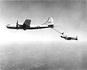 Republic F-84G Thunderjet, 51-767, takes on fuel from a ? Republic F-84G Thunderjet, 51-767, takes on fuel from a ?