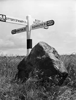 Prints of The Rolling Stone, at Putts Corner, Gittisham, Devon, England. Local folklore says that on a full moon the stone rolls down to the River Sid to wash away sacrificial blood Gittisham Prints: The Rolling Stone Print, Putts Corner, Devon