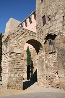 Roman Art. Ruins ot the roman wall and two arches from the a Roman Art. Ruins ot the roman wall and two arches from the a