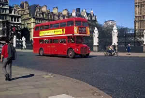Prints of A No.76 Routemaster bus drives past the Houses of Parliament, Westminster, on its way to Stoke Newington, north London Transport Prints: Routemaster Bus Print: Westminster Scene