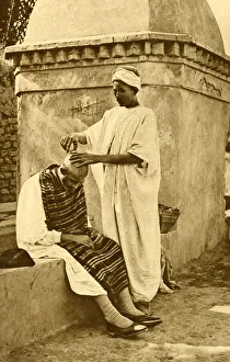Saharan barber and client, Algeria, North Africa Saharan barber and client, Algeria, North Africa