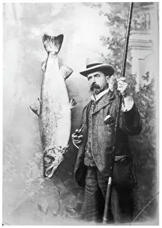 Prints of What a whopper! A Victorian gentleman stands proudly next to the salmon he has caught Salmon Prints: Victorian Gentleman with Large Salmon Print