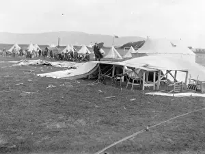 Print of a shooting range scene with collapsed tent