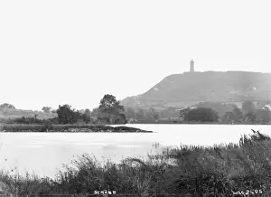 Prints of Scrabo - a view of the tower with water in the foreground. (Location: Northern Ireland; County Down; Newtownards). Date: circa early 1900s Newtownards Prints: Scrabo Tower Print - Newtownards, Northern Ireland