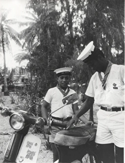 Sea scouts with moped, Gilbert Islands, Pacific Sea scouts with moped, Gilbert Islands, Pacific