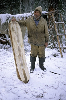 Selkup Man (North Siberia minority) shows his wooden Selkup Man (North Siberia minority) shows his wooden