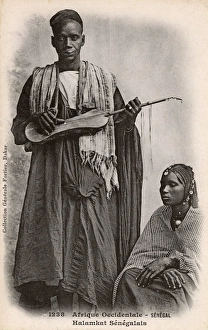 Senegal - Griot playing a Xalam Senegal - Griot playing a Xalam