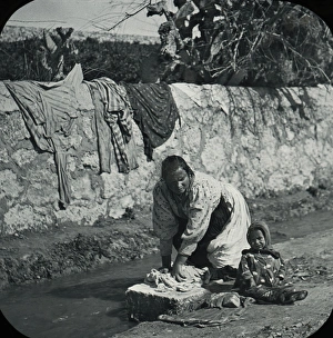 Sicily - Woman doing the laundery, Syracuse Sicily - Woman doing the laundery, Syracuse