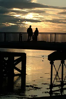 Silhouette - man and woman watching the sunset - Caernarfon Silhouette - man and woman watching the sunset - Caernarfon