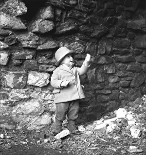 Ralph Ponsonby Watts Photographer Prints: Small boy in front of a wall