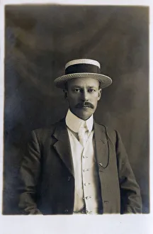 Smart and Handsome British Gentleman in straw boater hat Smart and Handsome British Gentleman in straw boater hat