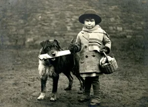 Social History - Dog brings home newspaper with young child Social History - Dog brings home newspaper with young child