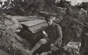 Soldier sitting by a dugout, Northern France, WW1 Soldier sitting by a dugout, Northern France, WW1