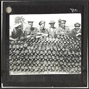Soldiers lean on pile of 18-pounder shells nr Becourt Wood Soldiers lean on pile of 18-pounder shells nr Becourt Wood
