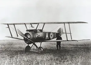 <b class=qtipBold><figcaption>Sopwith Camel F-1</figcaption></b><br>German Soldier Holding the Tail of Captured 3 Sqn Royal Flying Corps Rfc Sopwith Camel F-1 Date: 1917<br><em>© aviation-images.com / Mary Evans Picture Library</em> Sopwith Camel F-1