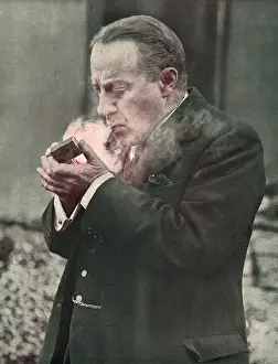 Prints of Stanley Baldwin, 1st Earl Baldwin of Bewdley (1867-1947), Conservative politician and Prime Minister Date: 1929 Stanley Baldwin Prints: Stanley Baldwin Lighting His Pipe Print 1929