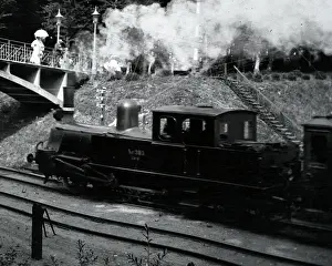 Edwardian Era Transport Prints: Steam train approaching a bridge