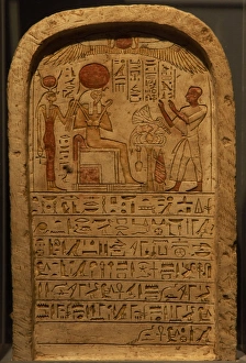 Stele depicting a priest making an offering to the god Ra. E Stele depicting a priest making an offering to the god Ra. E